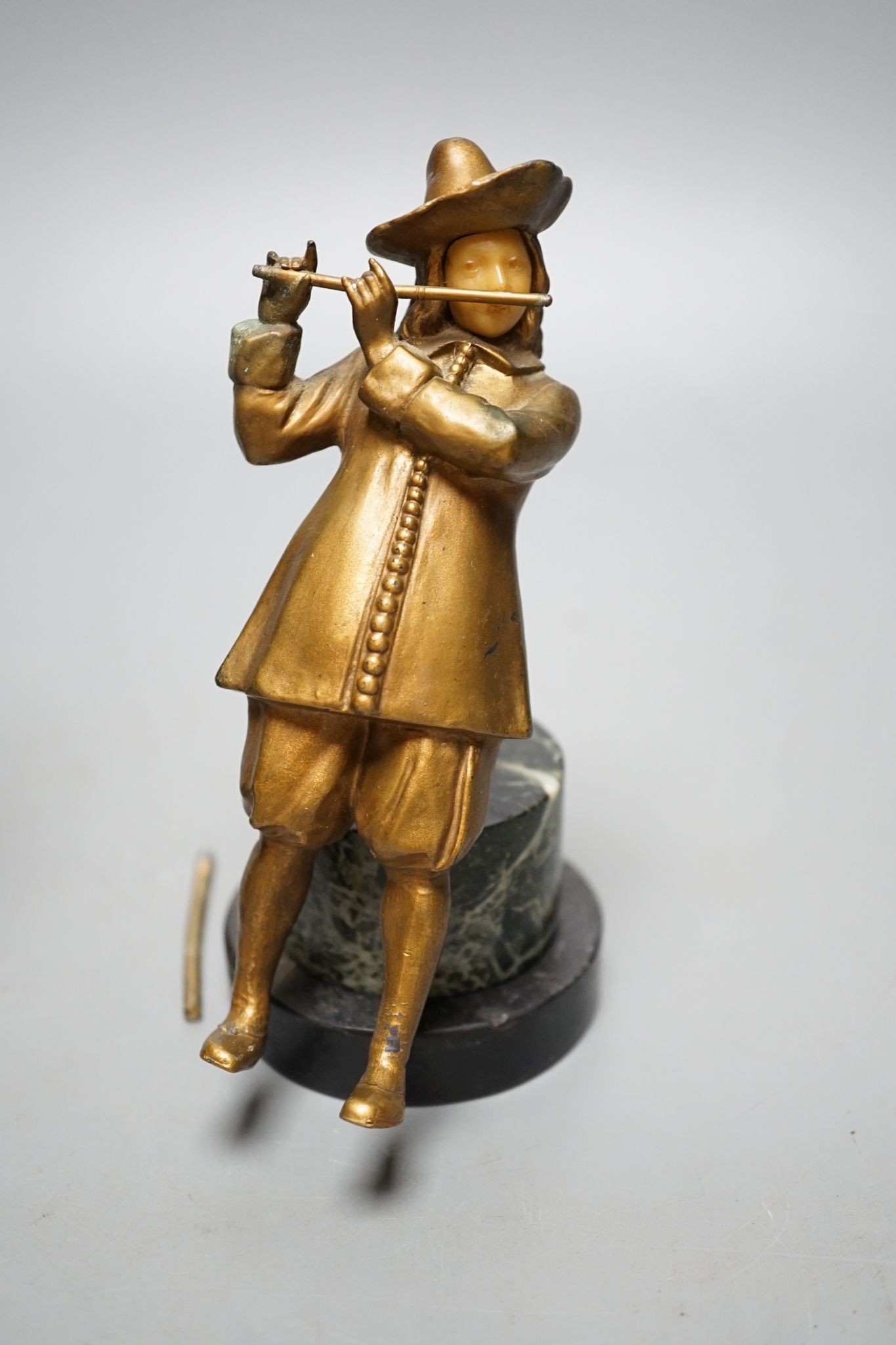 A pair of gilt spelter figures of magicians., 19 cms high.